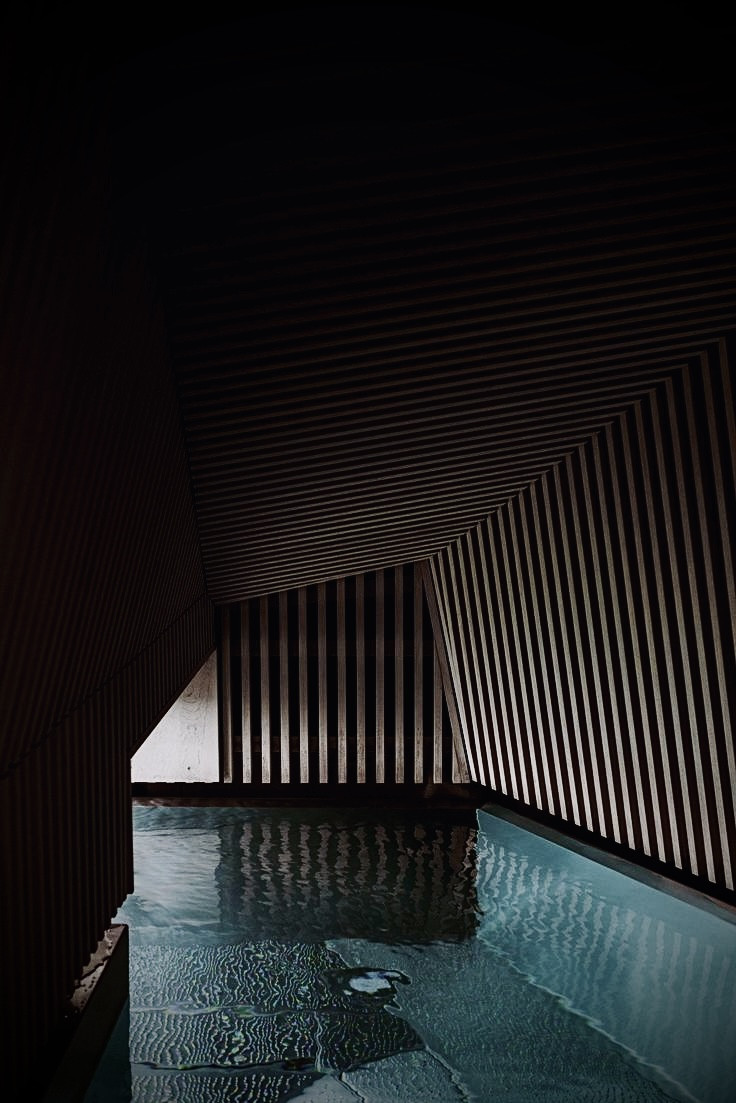 Hamaria Club luxury pool with architectural slatted ceiling featuring modern aquatic training facilities and sophisticated wellness design in Madrid